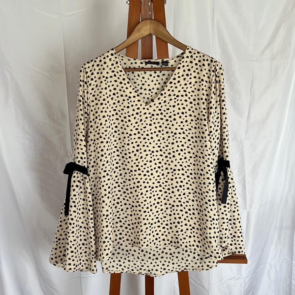 Halogen bell sleeve top. Bow and ribbon detail at elbow.